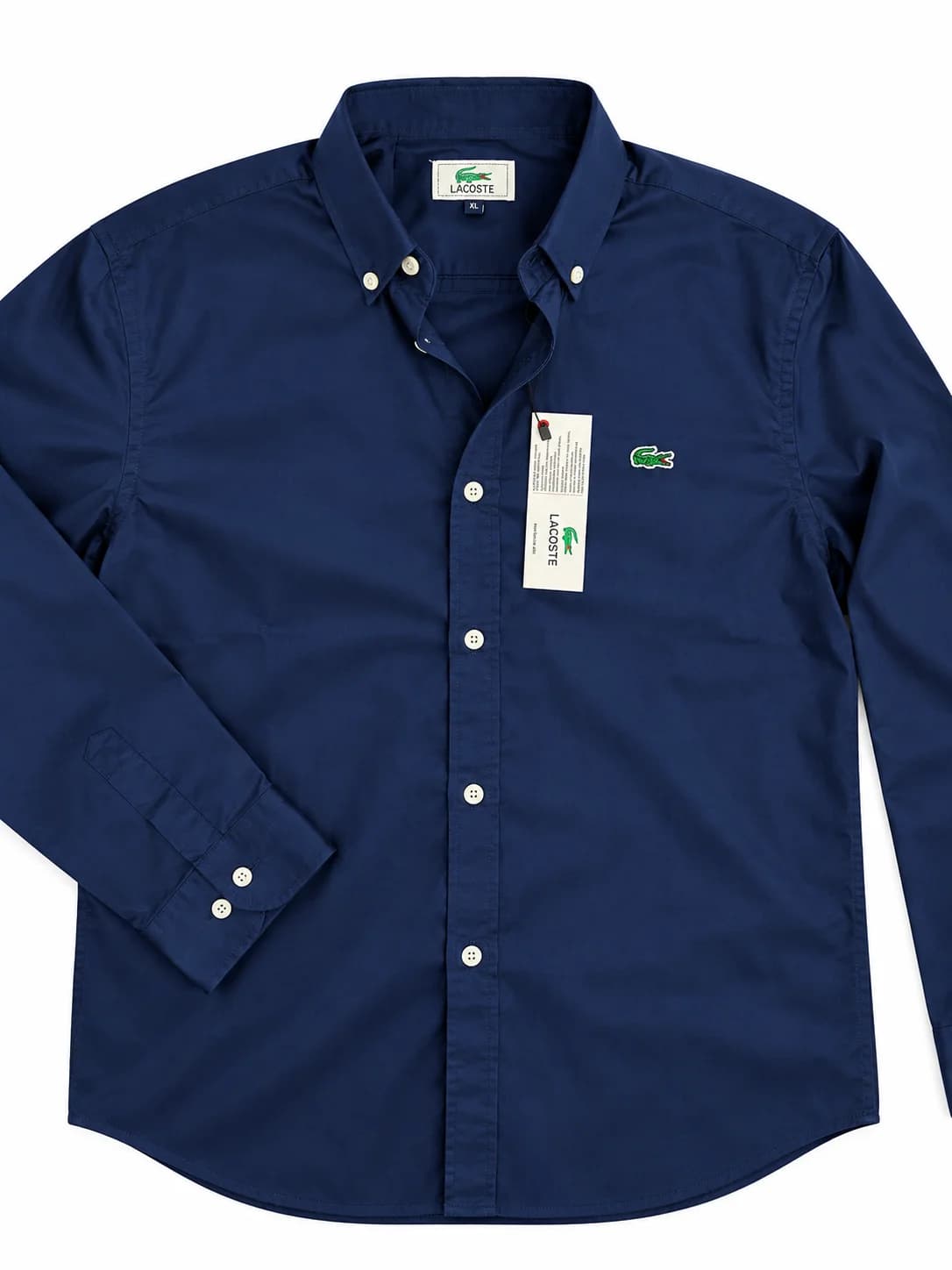 Lacoste Navy Blue Men's Full Sleeve Shirt Close-Up Showing Smooth Fabric Texture, White Button and Curved Bottom Hem Stitching   Copy
