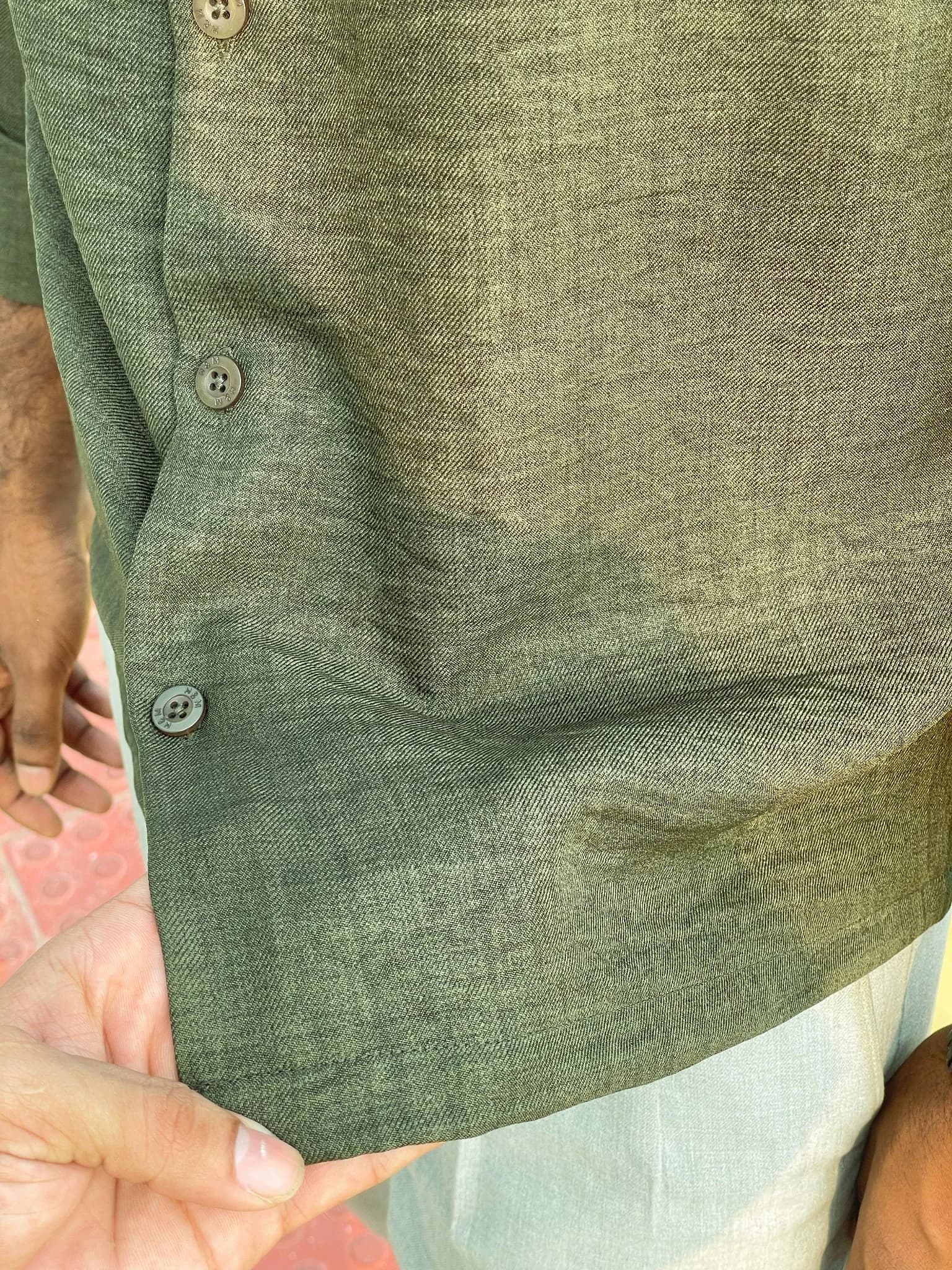 Back view of the men’s olive green boxy fit shirt